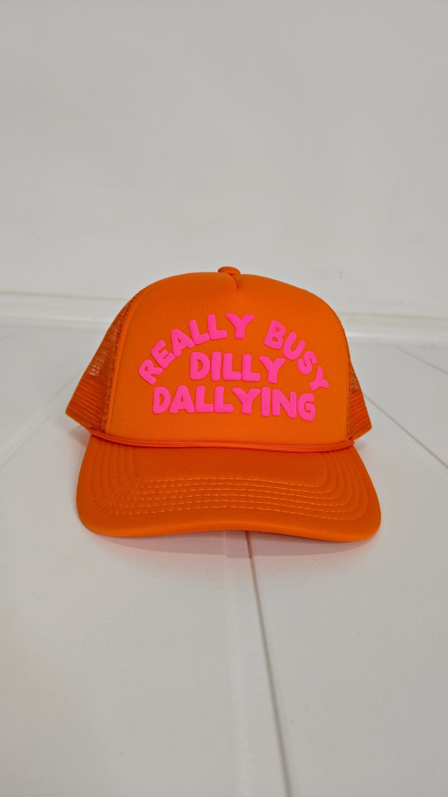 Orange Really Busy Dilly Dallying Trucker Hat "Brightyn"